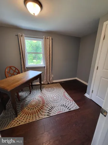 a view of a livingroom with furniture and window