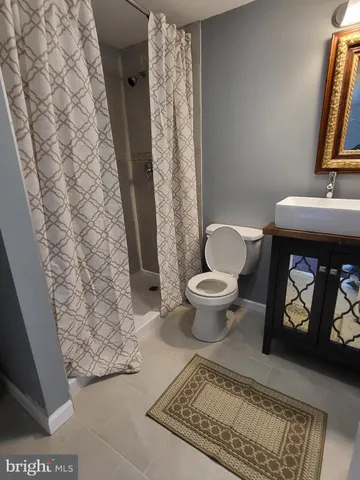 a bathroom with a toilet and a sink