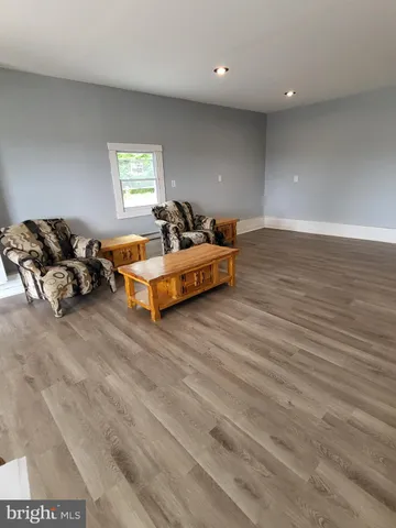 a spacious bedroom with a bed and a couch