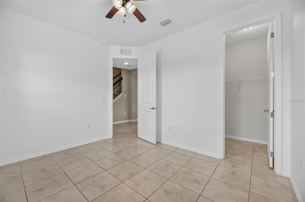 5811 Caldera Ridge Drive Lithia, FL 33547 - Photo 17 of 44 an empty room with closet and windows