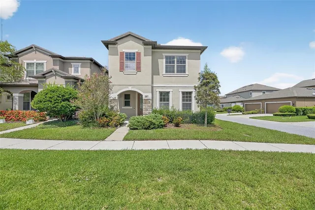 a front view of a house with a yard