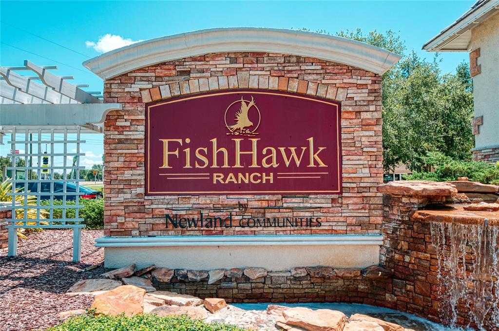 5811 Caldera Ridge Drive Lithia, FL 33547 - Photo 30 of 44 a sign on the side of a building