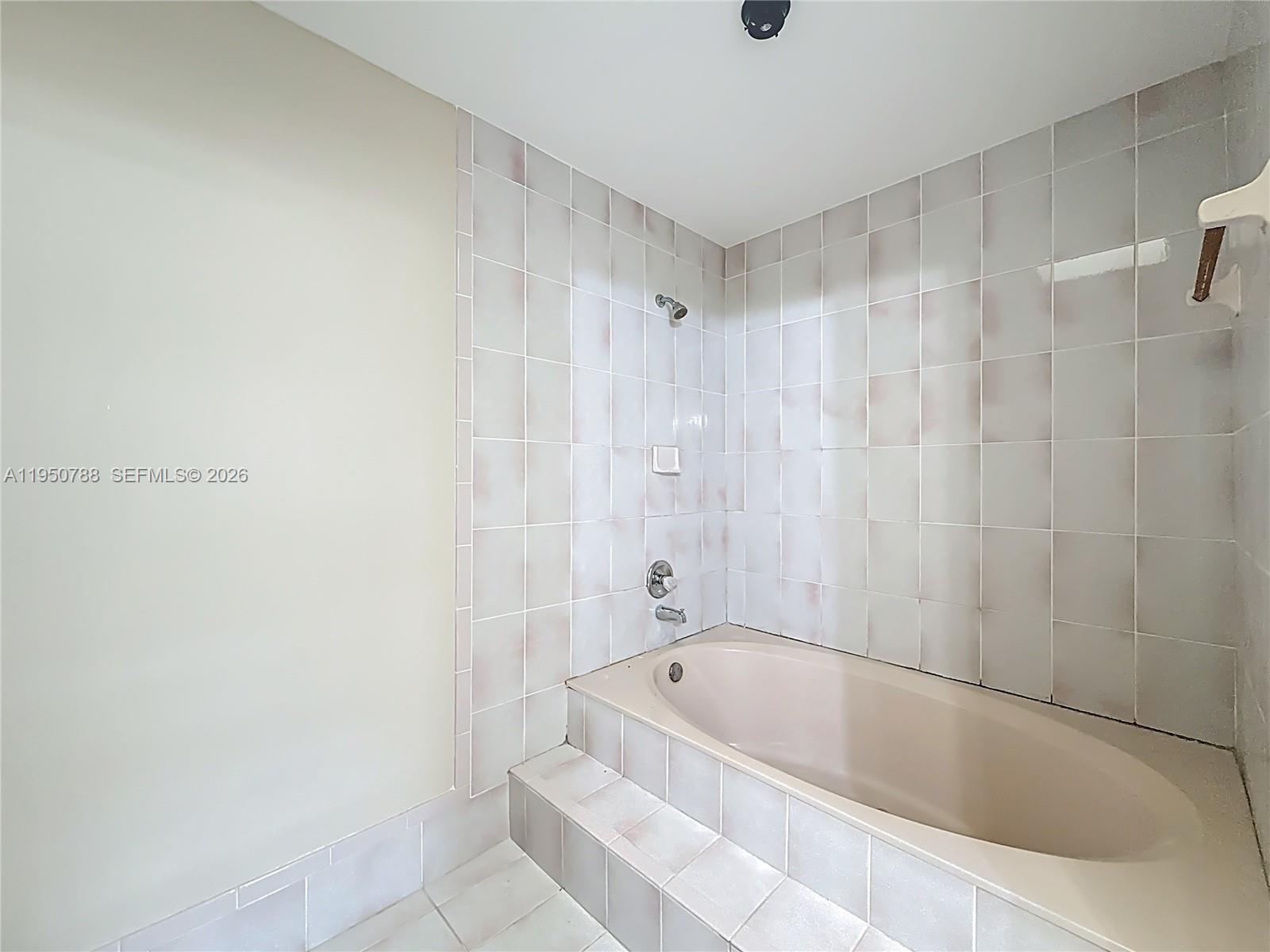 12787 Northwest 10th Lane Miami, FL 33182 - Photo 31 of 48 a bathroom with a bathtub