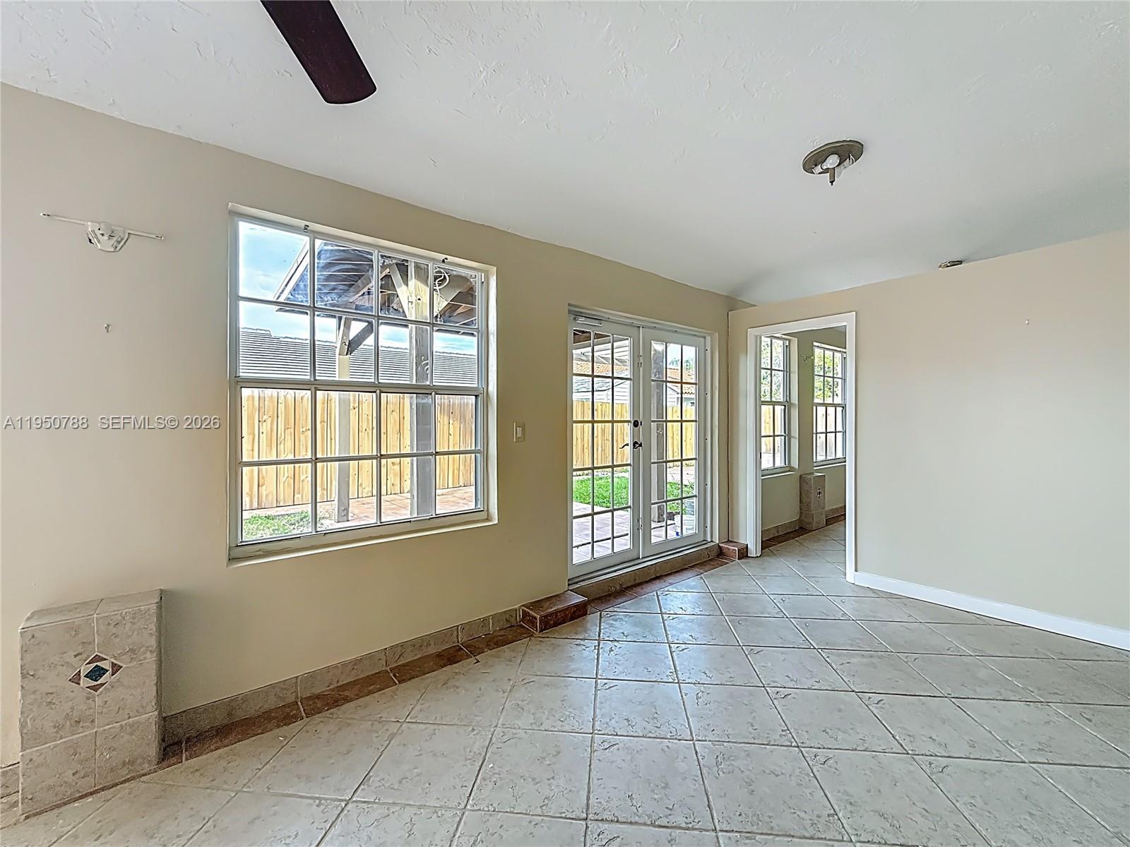 12787 Northwest 10th Lane Miami, FL 33182 - Photo 37 of 48 a view of an empty room with a window