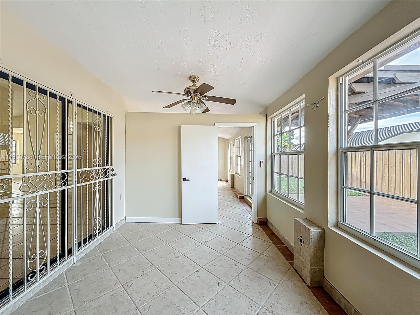 12787 Northwest 10th Lane Miami, FL 33182 - Photo 38 of 48 a view of a hallway with windows