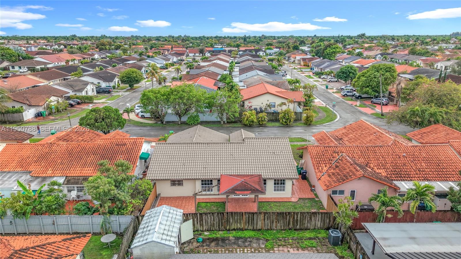 12787 Northwest 10th Lane Miami, FL 33182 - Photo 45 of 48 an aerial view of residential houses with outdoor space and trees