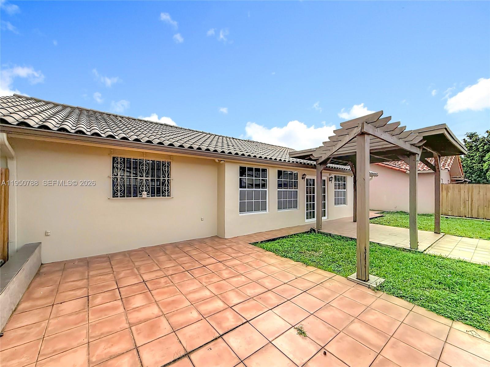 12787 Northwest 10th Lane Miami, FL 33182 - Photo 48 of 48 a view of a house with a yard