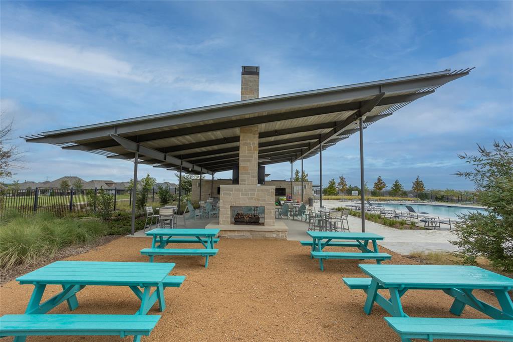 10505 Trail Ridge Drive Fort Worth, TX 76126 - Photo 32 of 37 a roof deck with table and chairs a barbeque with potted plants