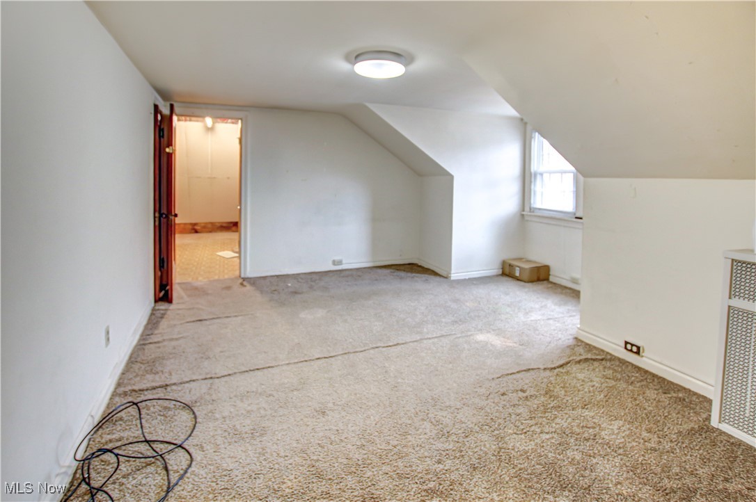 17800 Winslow Road Beachwood, OH 44122 - Photo 28 of 31 Additional living space featuring light colored carpet and vaulted ceiling