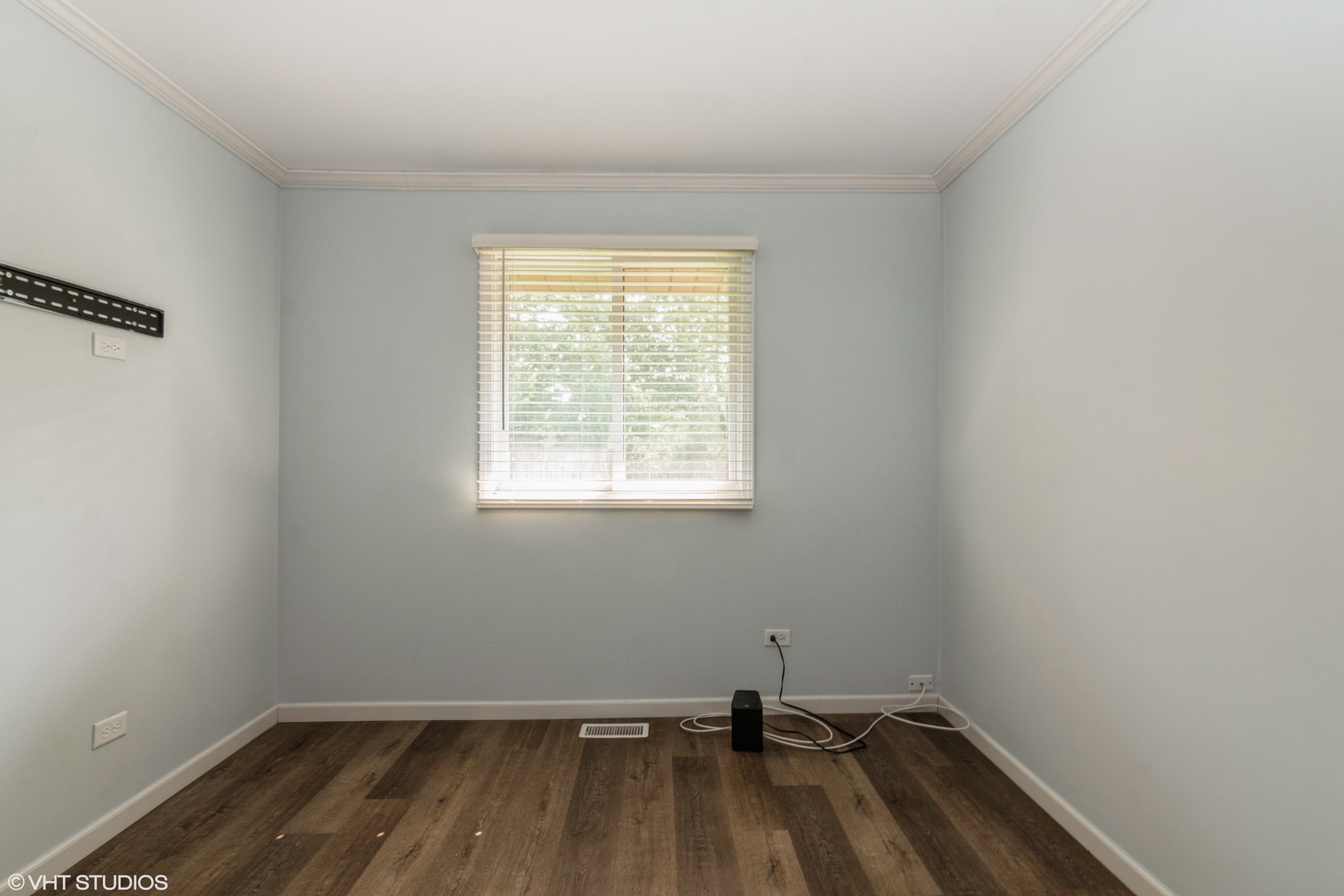 1555 Vincennes Street Crete, IL 60417 - Photo 13 of 18 a room with a window and wooden floor