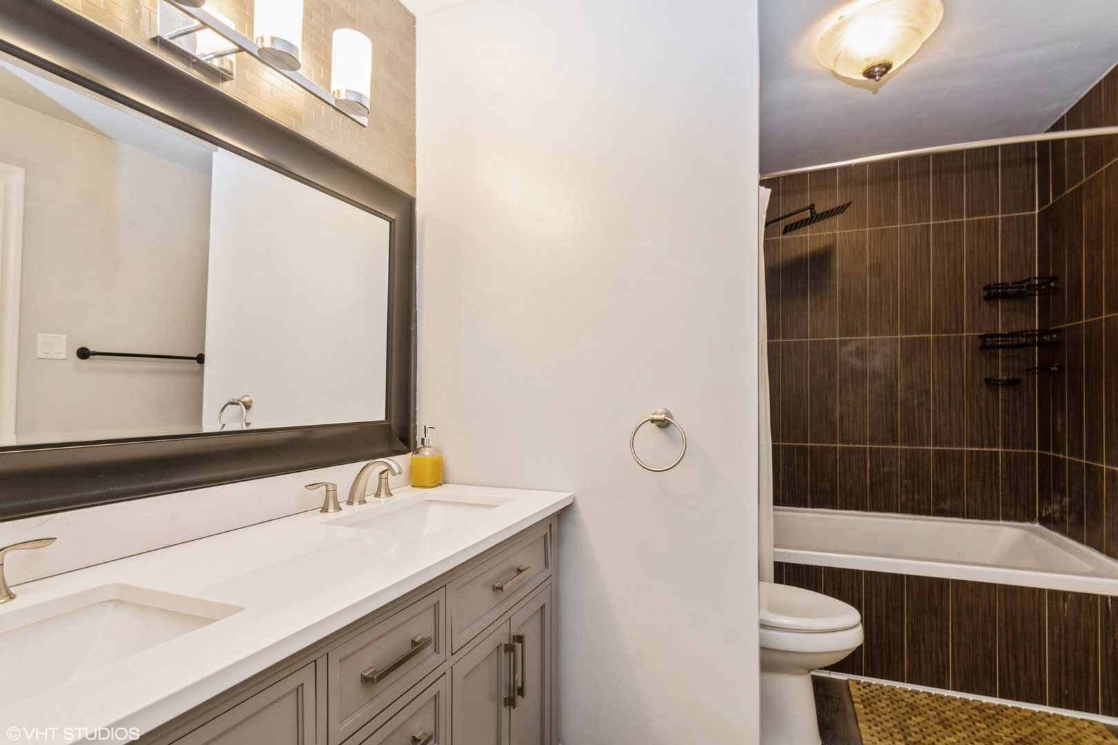 1555 Vincennes Street Crete, IL 60417 - Photo 14 of 18 a bathroom with a sink a toilet and shower