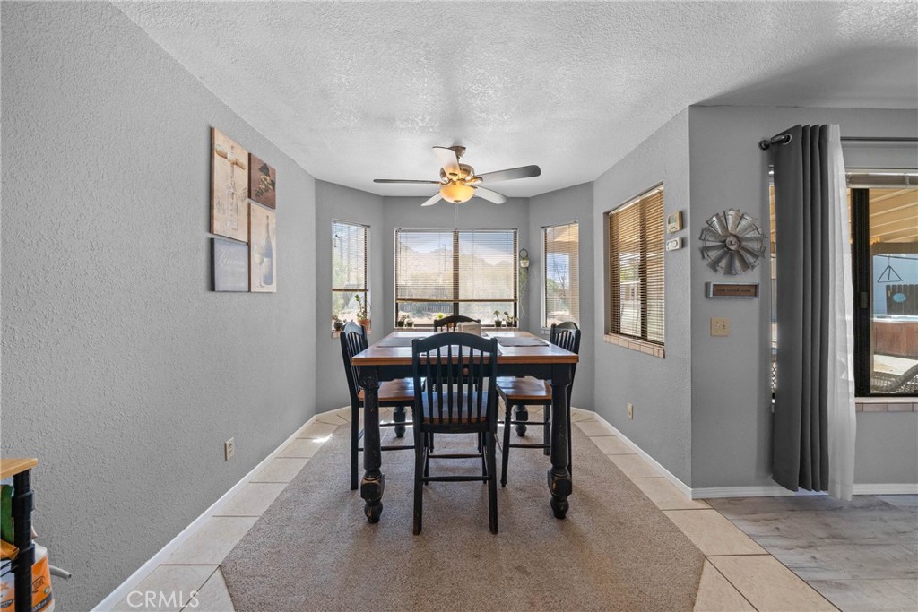 16161 St Timothy Road Apple Valley, CA 92307 - Photo 20 of 35 a dining room with furniture and window