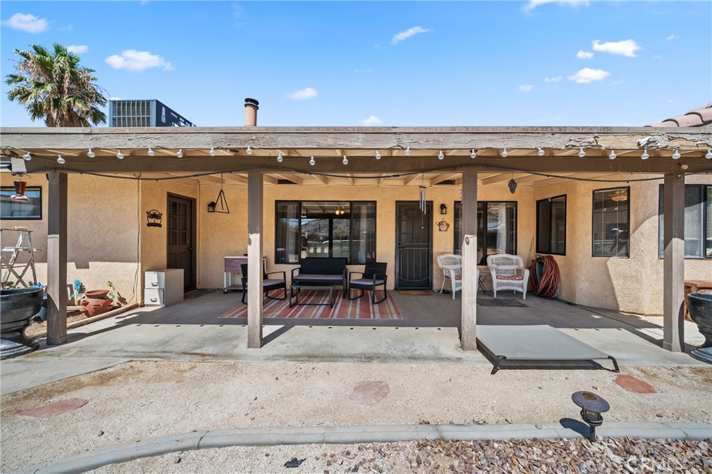 16161 St Timothy Road Apple Valley, CA 92307 - Photo 31 of 35 a view of a swimming pool with outdoor seating
