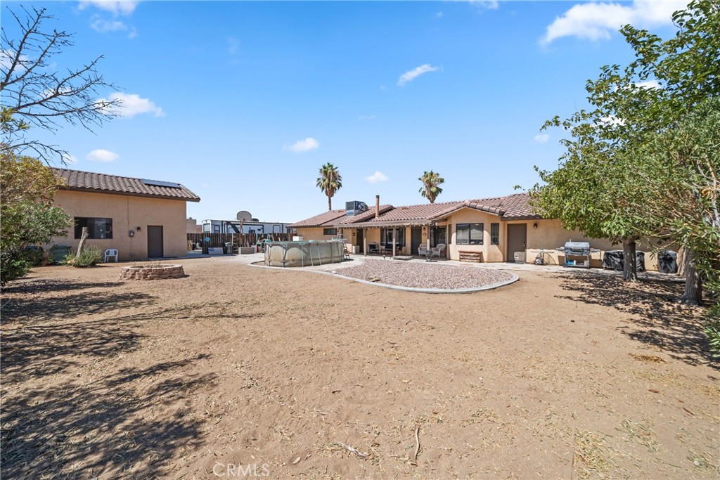 16161 St Timothy Road Apple Valley, CA 92307 - Photo 32 of 35 a front view of a house with a yard
