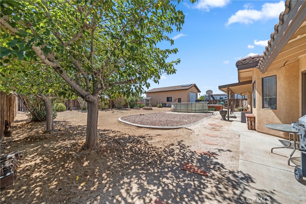 16161 St Timothy Road Apple Valley, CA 92307 - Photo 33 of 35 a view of a house with backyard and sitting area
