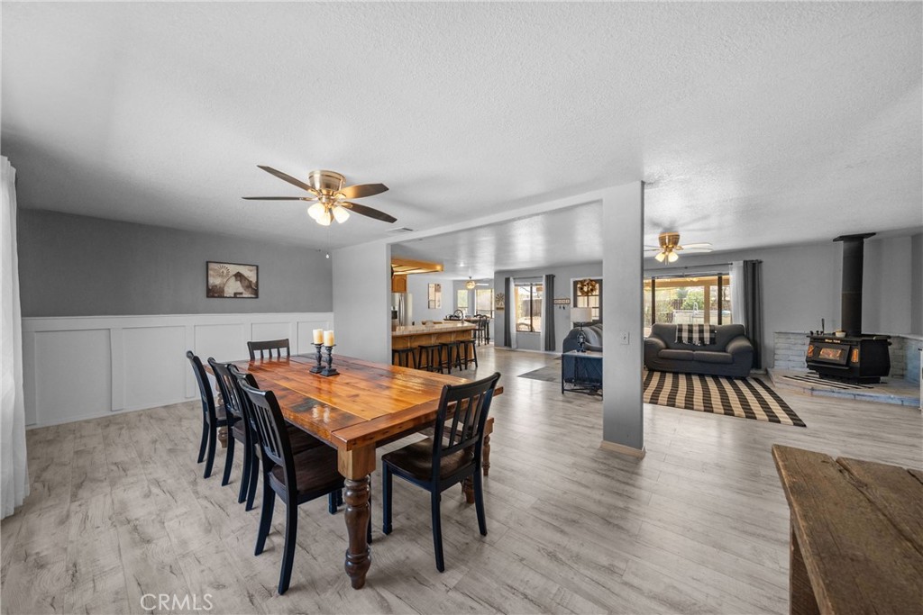 16161 St Timothy Road Apple Valley, CA 92307 - Photo 9 of 35 a view of a dining room with furniture and wooden floor