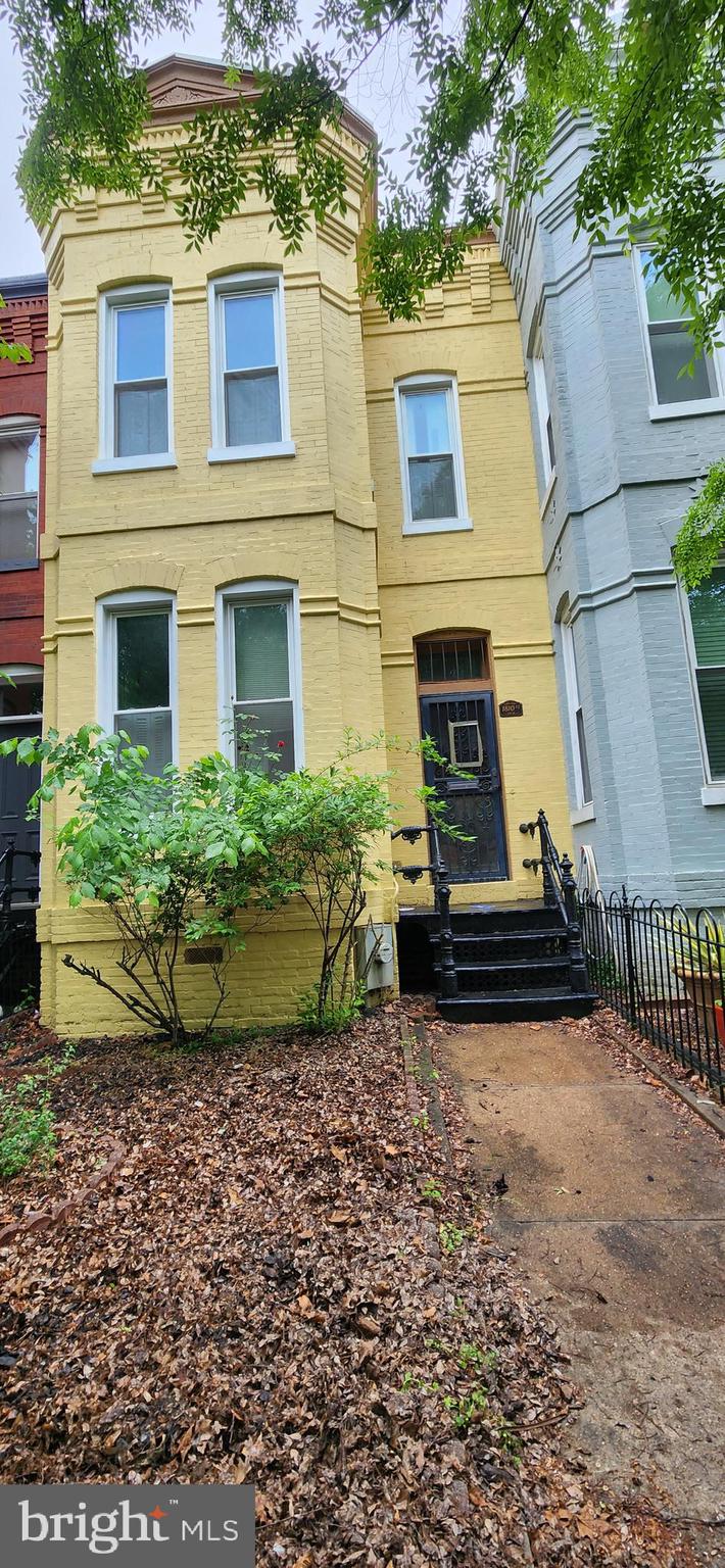 1810 6th Street Northwest Washington, DC 20001 - Photo 2 of 2 a view of a house with a small yard and large tree