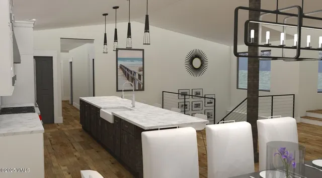 a living room with stainless steel appliances kitchen island granite countertop furniture a fireplace and a flat screen tv