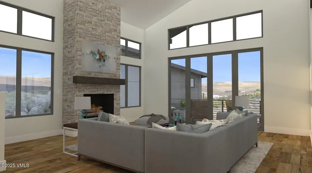 a living room with furniture a rug and white walls