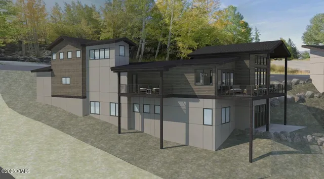 a view of a house with a small yard and a large tree