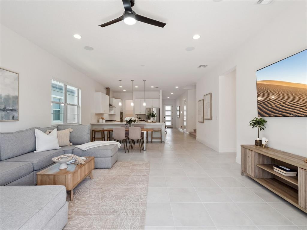 2932 Tupelo Loop St. Cloud, FL 34772 - Photo 17 of 47 a living room with furniture and a flat screen tv