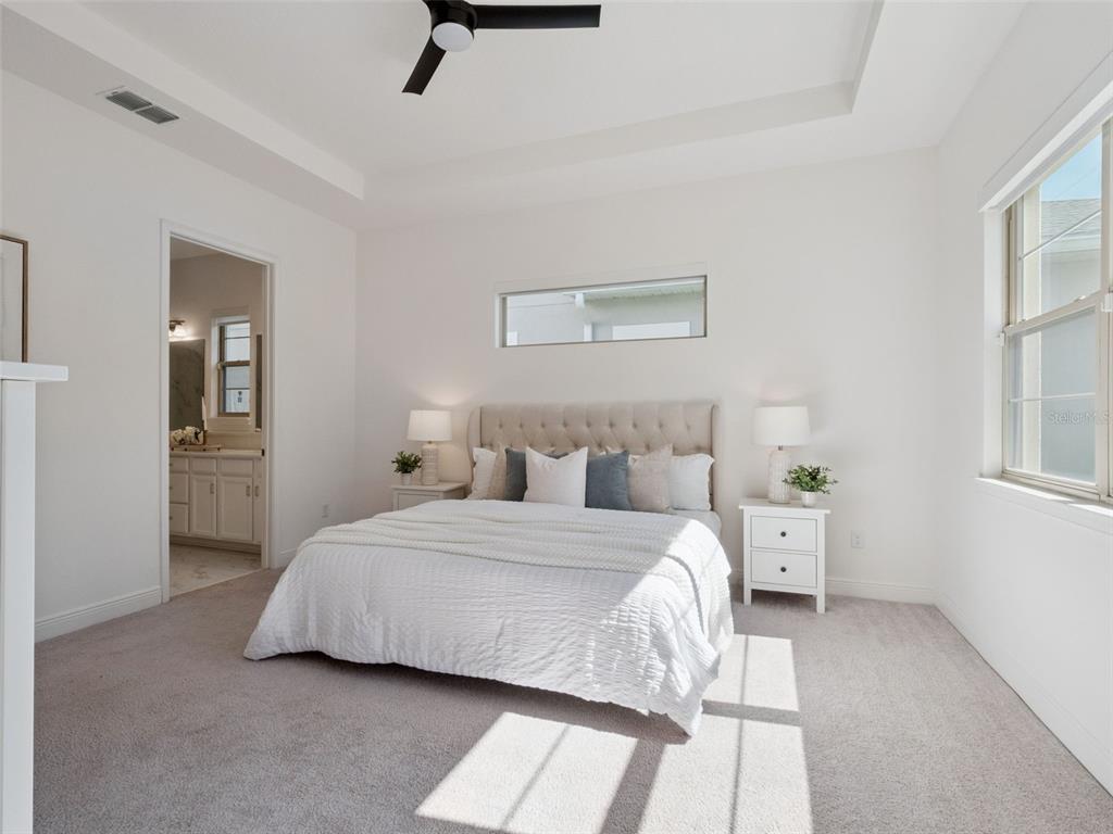 2932 Tupelo Loop St. Cloud, FL 34772 - Photo 20 of 47 a bedroom with a bed and a window