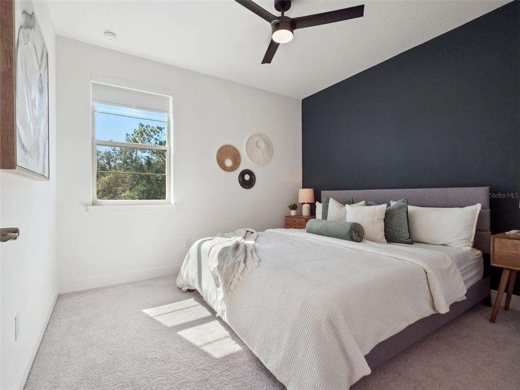 2932 Tupelo Loop St. Cloud, FL 34772 - Photo 28 of 47 a bedroom with bed and a window