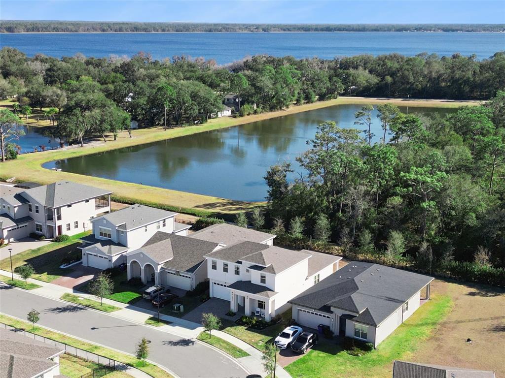 2932 Tupelo Loop St. Cloud, FL 34772 - Photo 33 of 47 an aerial view of a house with a lake view
