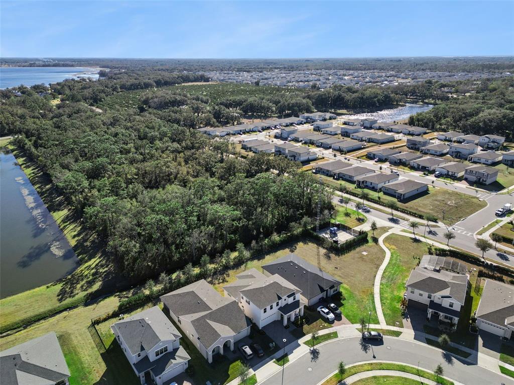 2932 Tupelo Loop St. Cloud, FL 34772 - Photo 42 of 47 an aerial view of a city with lots of residential buildings