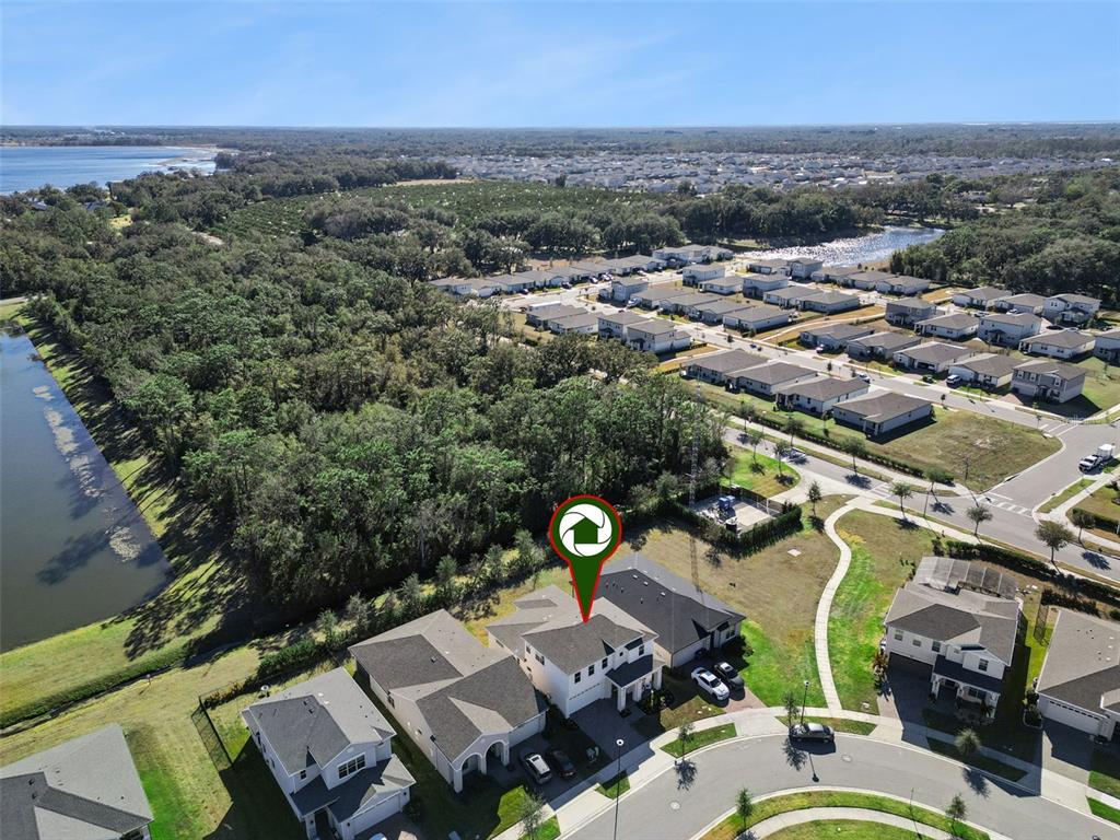 2932 Tupelo Loop St. Cloud, FL 34772 - Photo 43 of 47 an aerial view of a city with lots of residential buildings