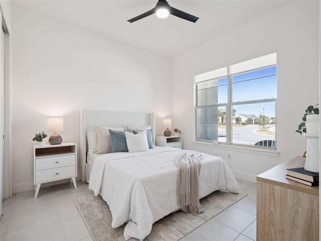 2932 Tupelo Loop St. Cloud, FL 34772 - Photo 5 of 47 a bedroom with a bed and a window