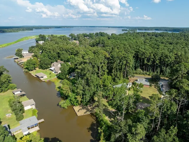 a view of a lake with a yard