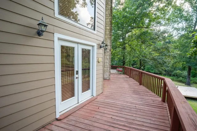 a view of balcony and deck with wooden floor