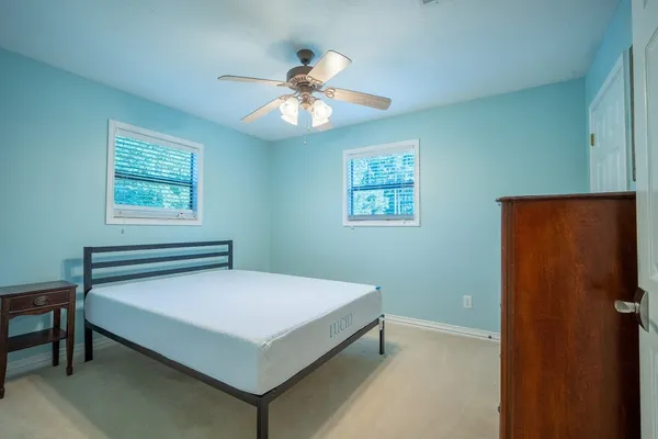 a bedroom with a bed and a table