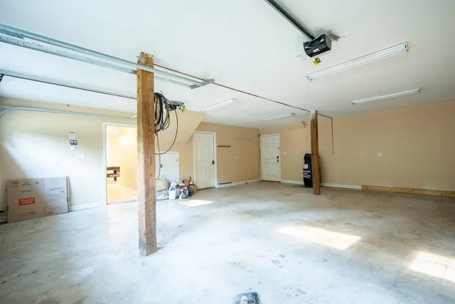 a view of a big room with closet and windows