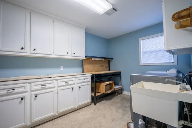 a room with a sink and a window