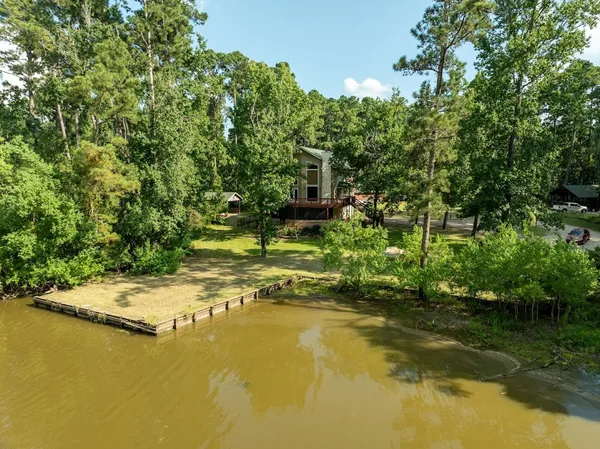 a view of a lake view with houses in back