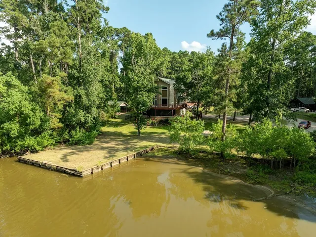 a view of a lake view with houses in back