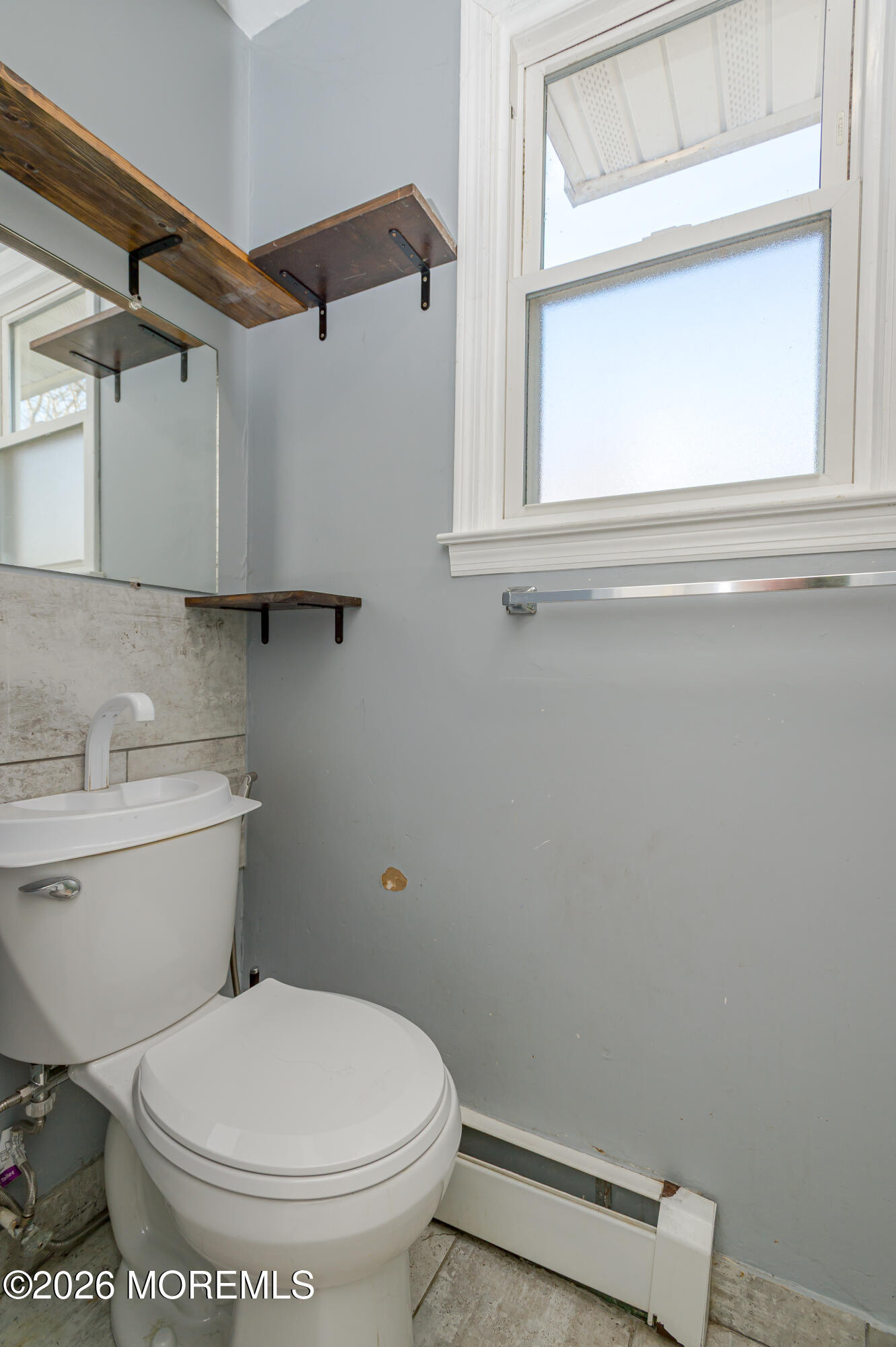 878 Green Valley Road Jackson, NJ 08527 - Photo 14 of 28 a white toilet sitting next to a bathroom sink
