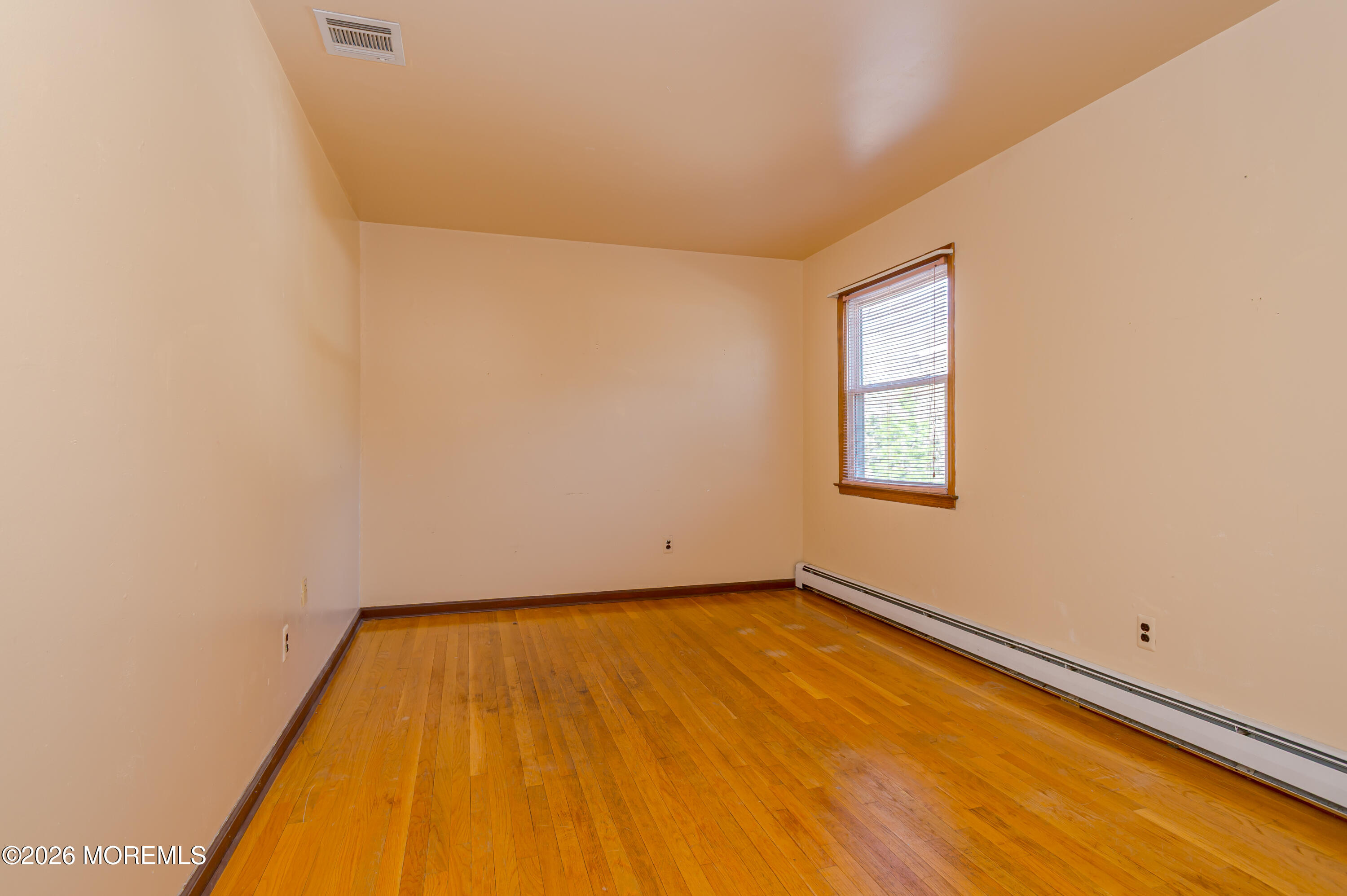 878 Green Valley Road Jackson, NJ 08527 - Photo 20 of 28 a view of a room with a wooden floor and a window