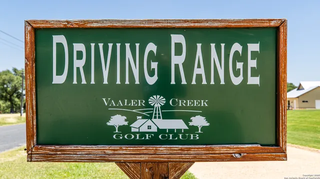 a view of swimming pool with a garden and seating area