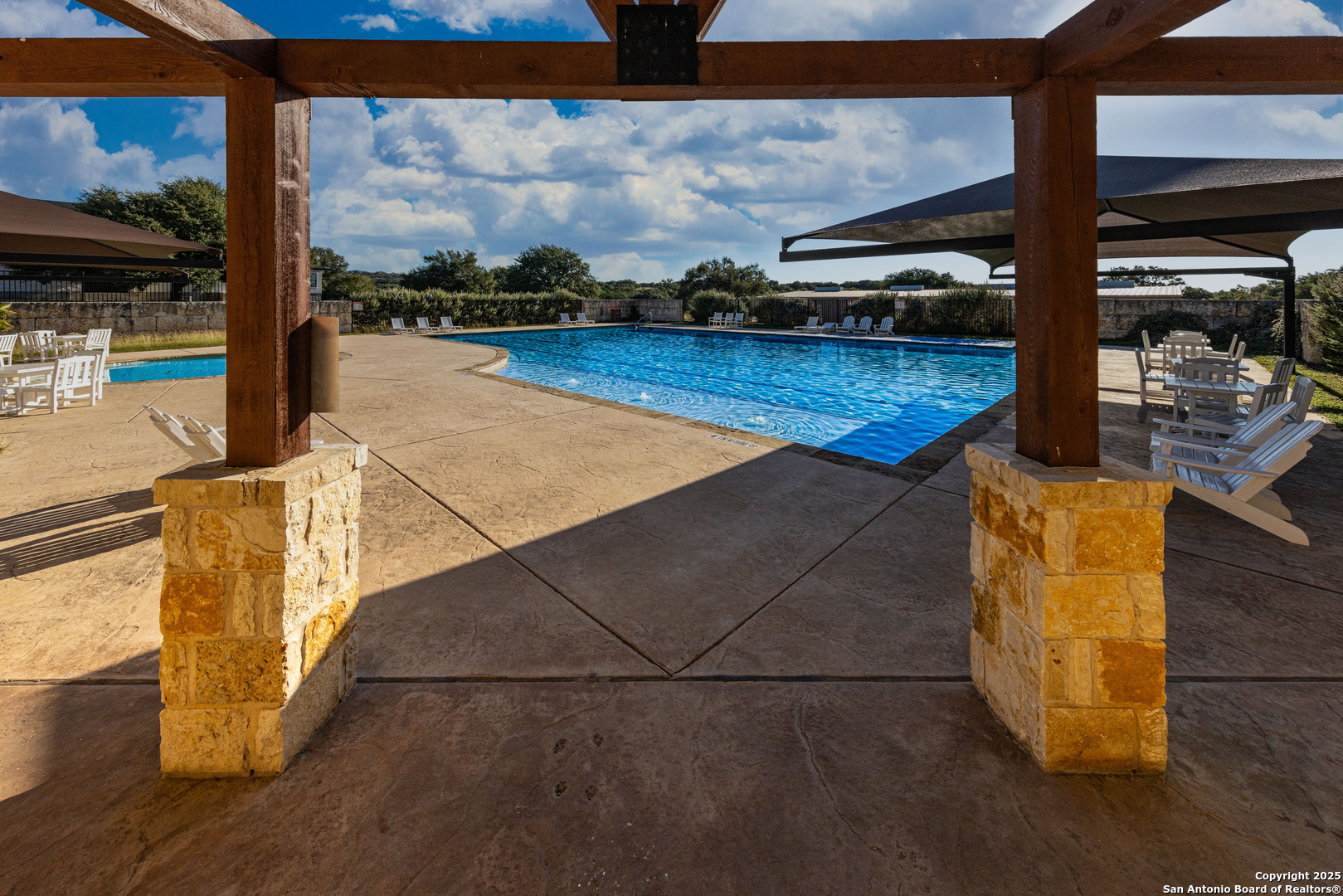 104 Capt Castro Blanco, TX 78606 - Photo 25 of 30 a view of a living room with floor to ceiling window and wooden floor