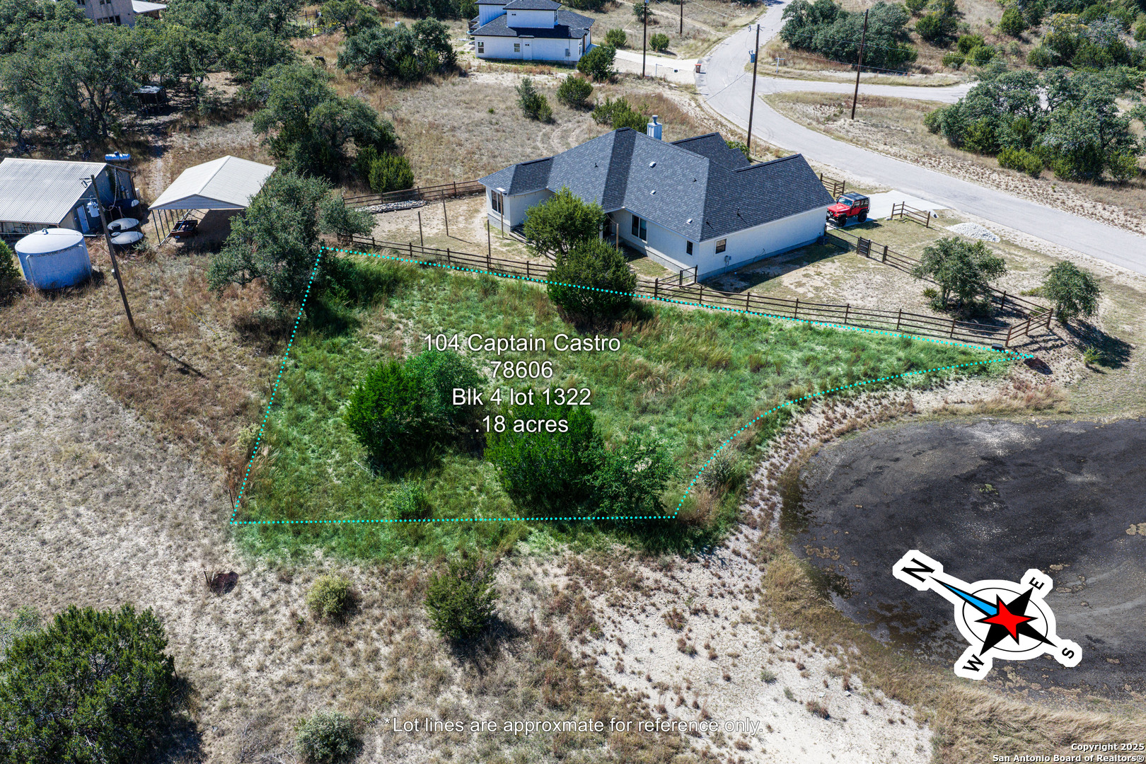 104 Capt Castro Blanco, TX 78606 - Photo 9 of 30 an aerial view of a house with a yard and a large tree