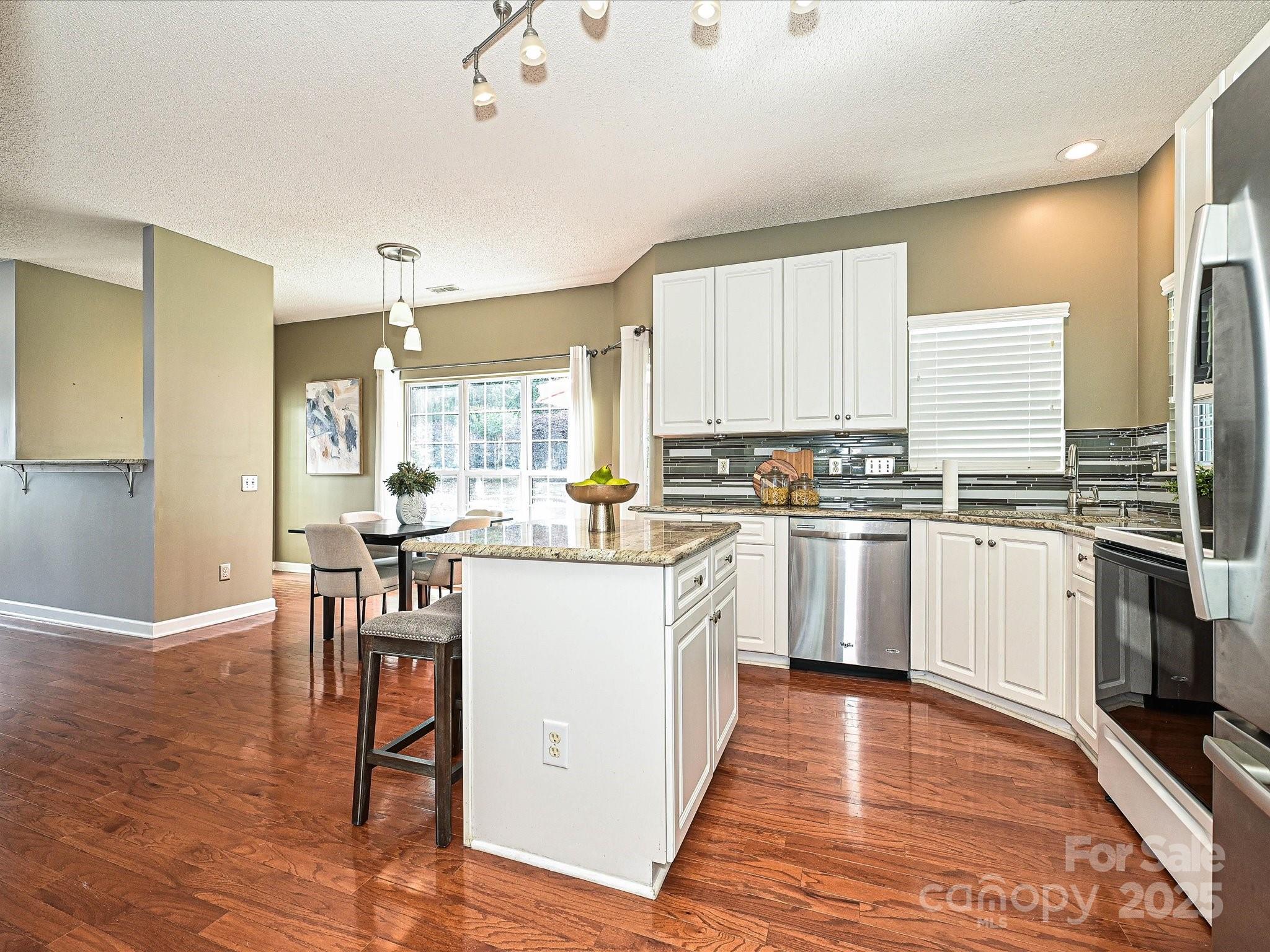 557 South Portman Lane Fort Mill, SC 29708 - Photo 11 of 29 a kitchen with sink a microwave and cabinets