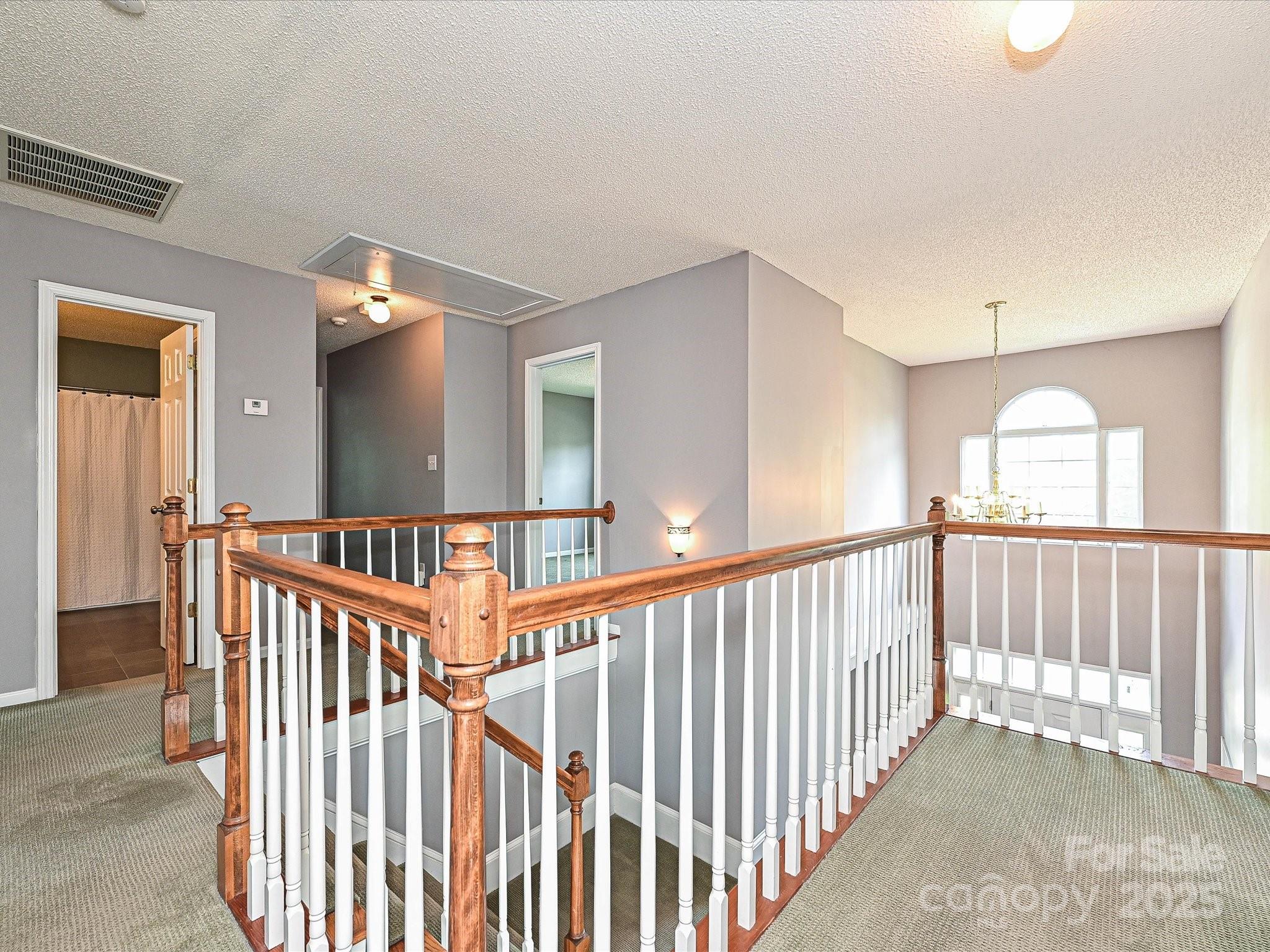 557 South Portman Lane Fort Mill, SC 29708 - Photo 18 of 29 a view of staircase with rug floor