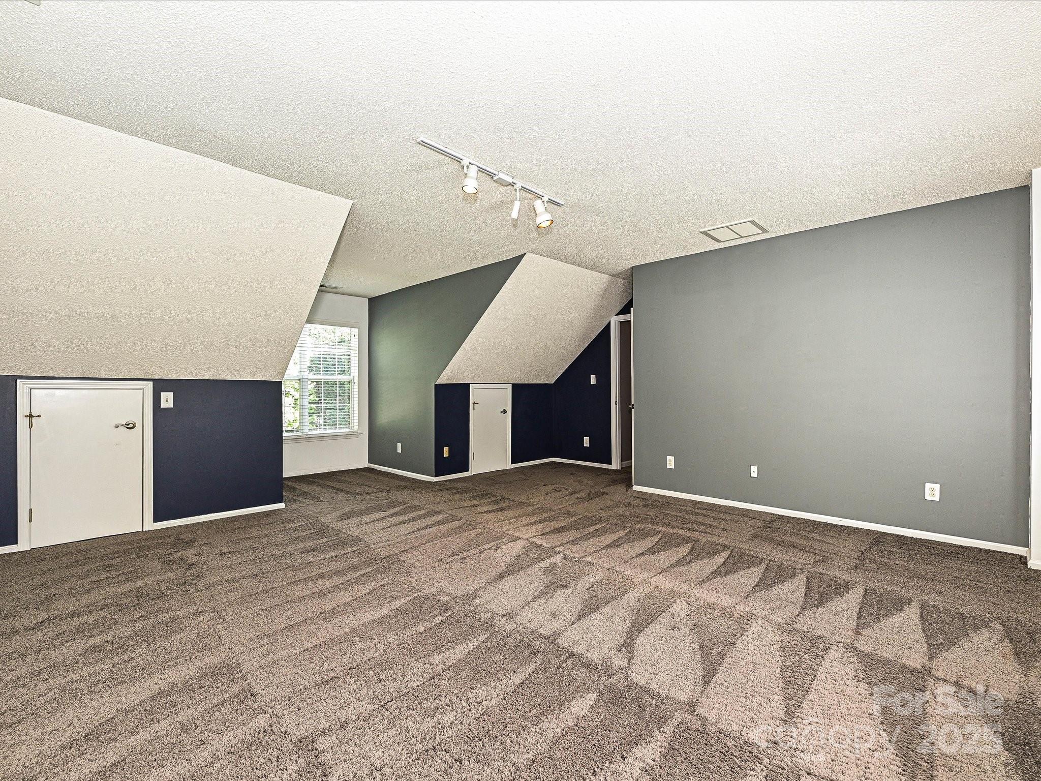 557 South Portman Lane Fort Mill, SC 29708 - Photo 22 of 29 a view of empty room with a ceiling fan and window