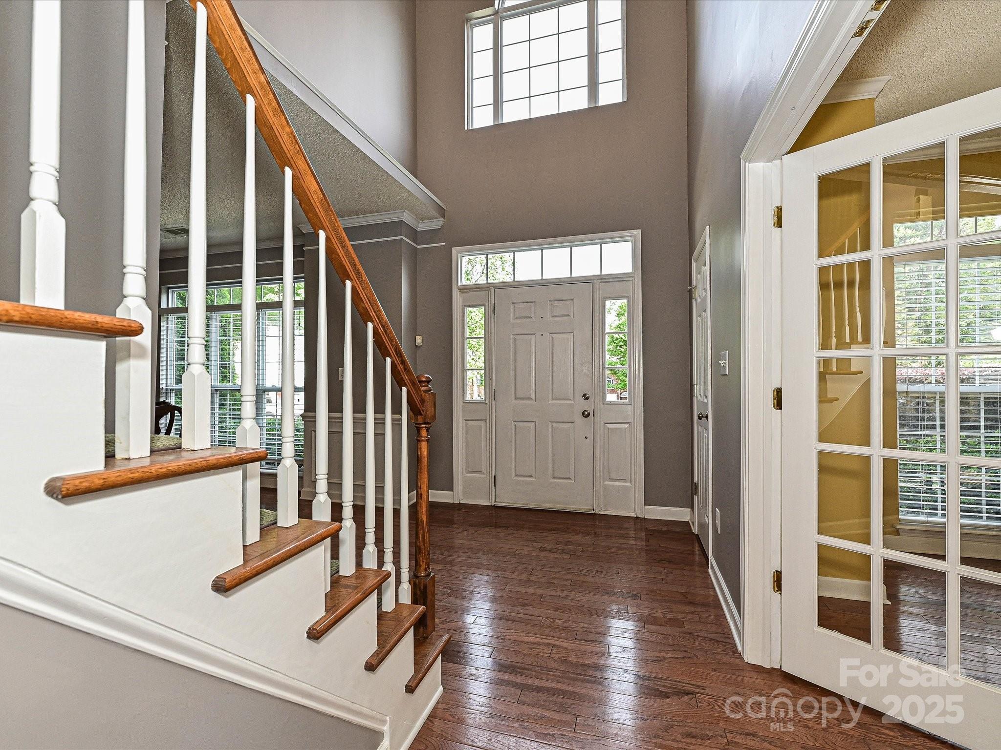557 South Portman Lane Fort Mill, SC 29708 - Photo 3 of 29 a view of a hallway with wooden floor and windows