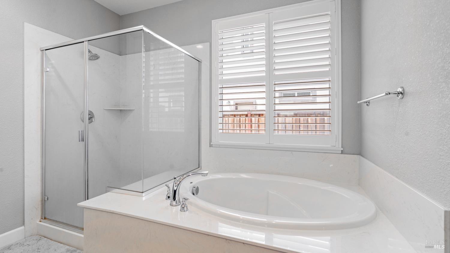 761 Razorbill Street Vacaville, CA 95688 - Photo 17 of 41 a white bath tub sitting next to a white sink and a shower