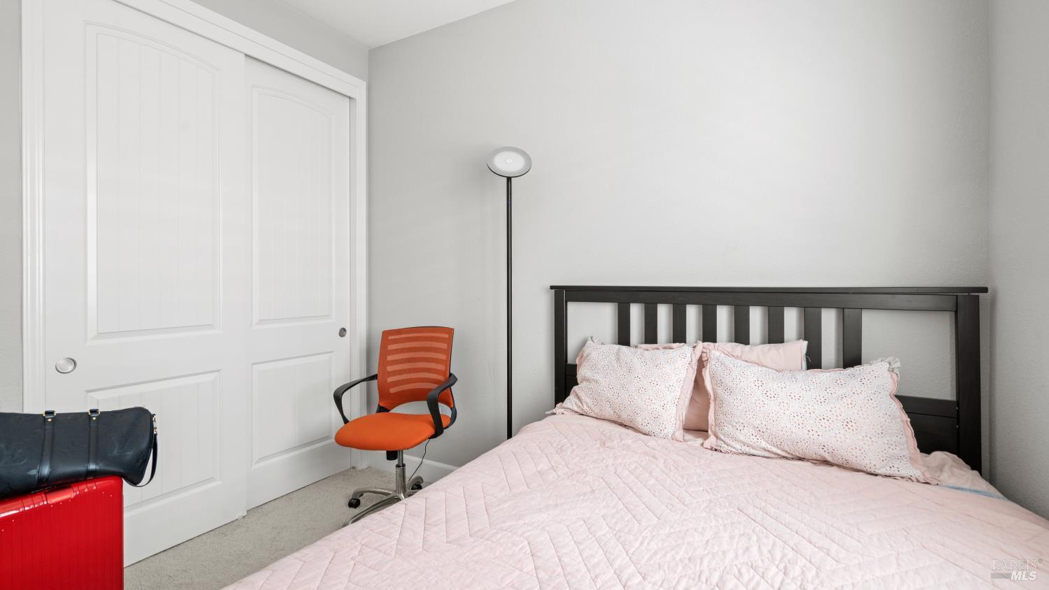 761 Razorbill Street Vacaville, CA 95688 - Photo 22 of 41 a bedroom with bed and a couch