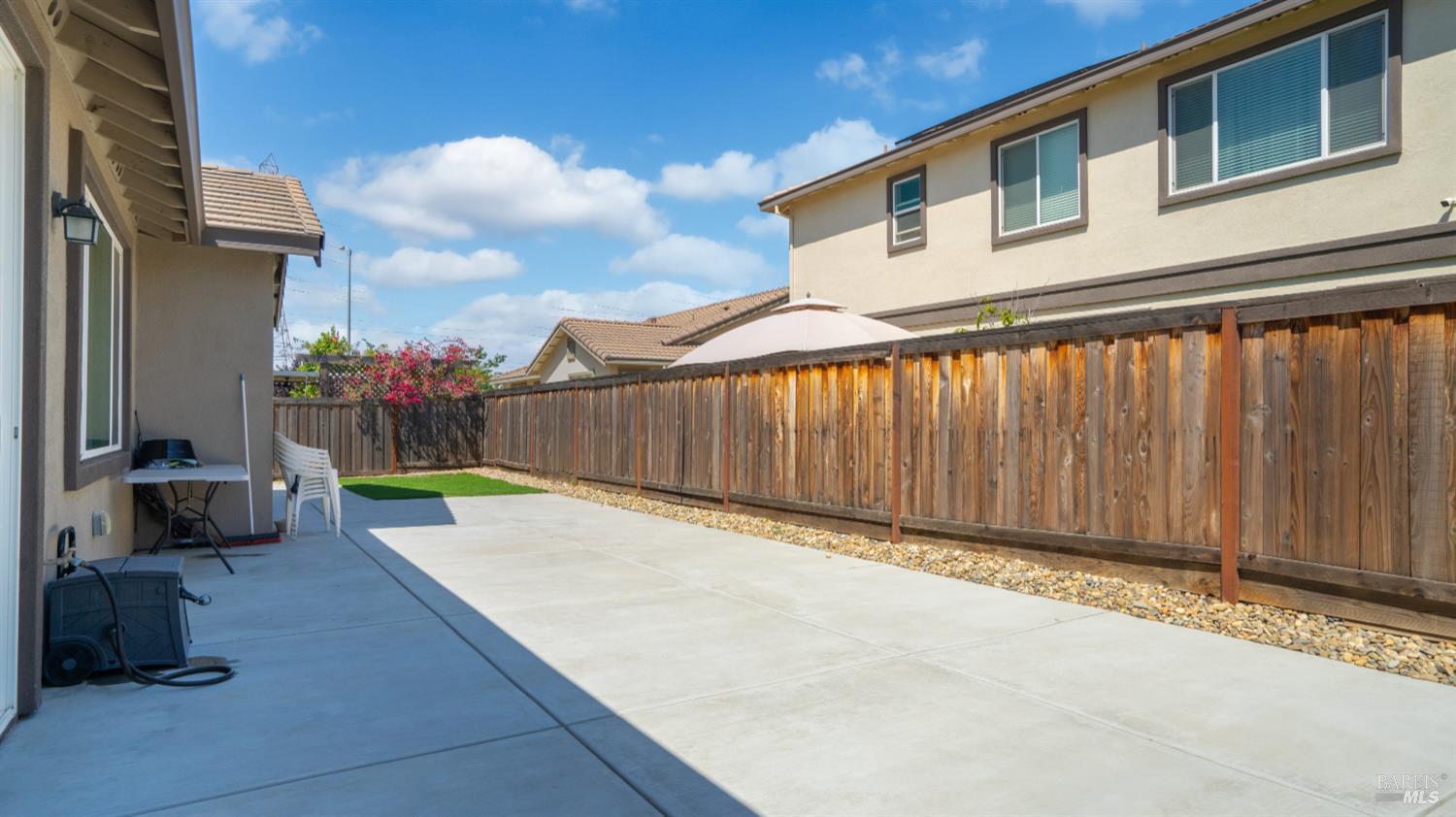 761 Razorbill Street Vacaville, CA 95688 - Photo 23 of 41 a view of a backyard with a wooden fence